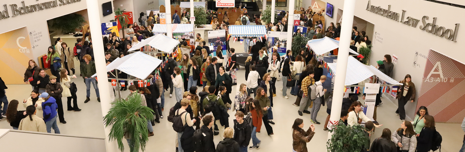 Students in a large hall at an information market.